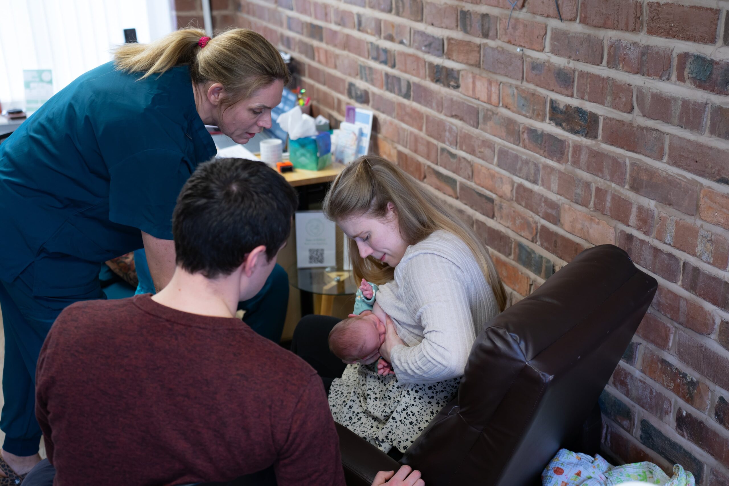 Laura helping a new mum with the breastfeeding latch at their infant feeding clinic in Chester